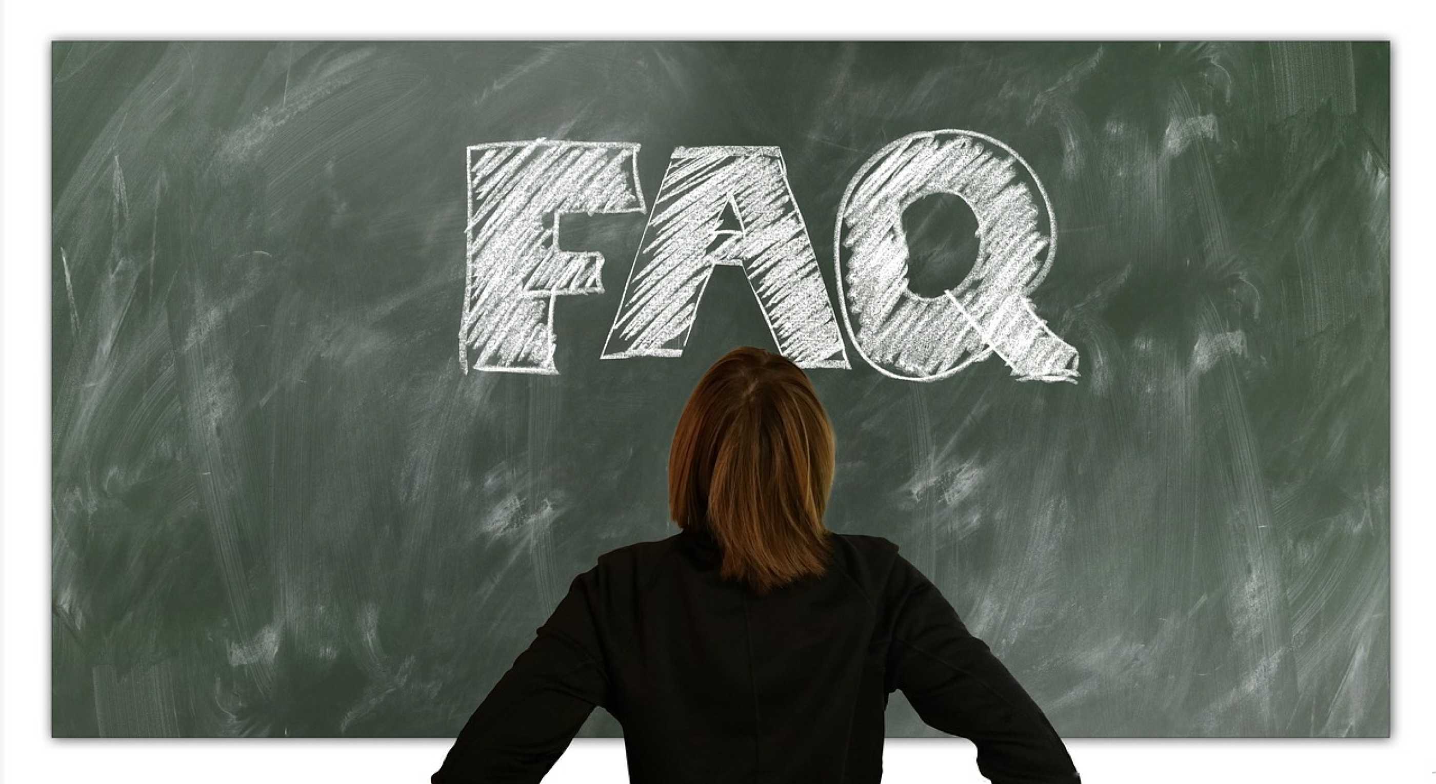 FAQ written in chalk on a blackboard