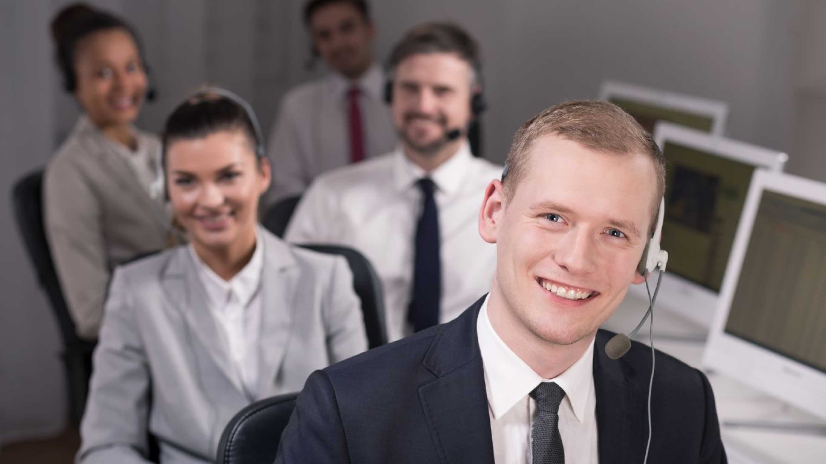 Smiling people in a call centre